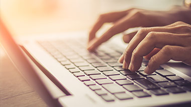 typing on a laptop
