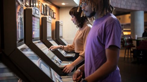 Guests placing wagers at the betting kiosks.