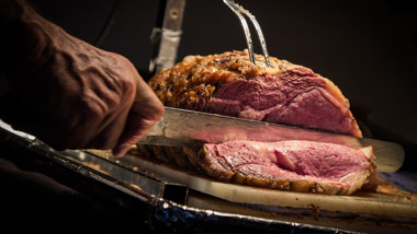 carving station at buffet with prime rib