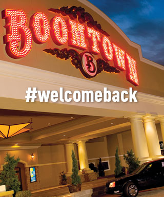 exterior of Boomtown Casino Bossier City with text "#welcomeback"