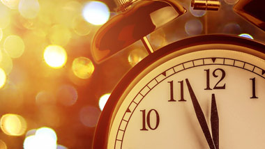 alarm clock with gold bokeh background